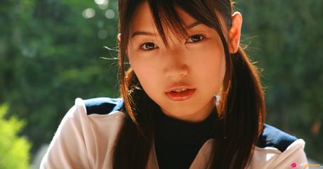 Asian cutie Noriko Kijima gets naked in white socks atop a bed