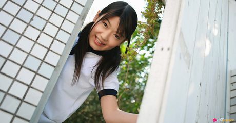 Asian cutie Noriko Kijima gets naked in white socks atop a bed