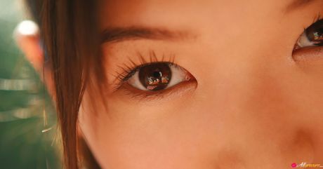 Asian cutie Noriko Kijima gets naked in white socks atop a bed