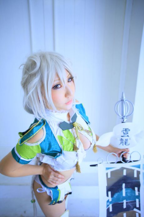 Asian teen Saku unveils her big juggs and poses in a sexy outfit