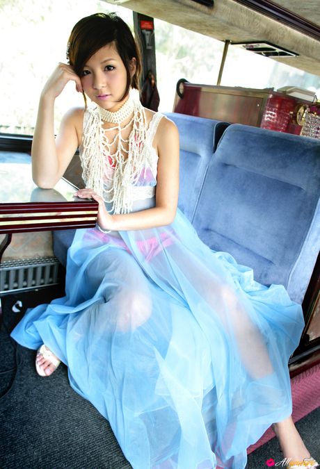 Asian teen Rina Nagasaki doffs her dress and demonstrates her hot body