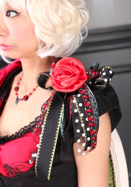 She poses in a red dress and black panties, and then she takes off