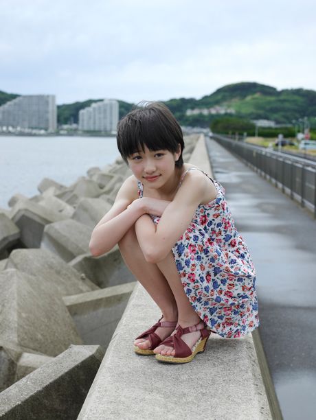 Asian beauty Haruka Kudo shows her nice tits and poses in a solo