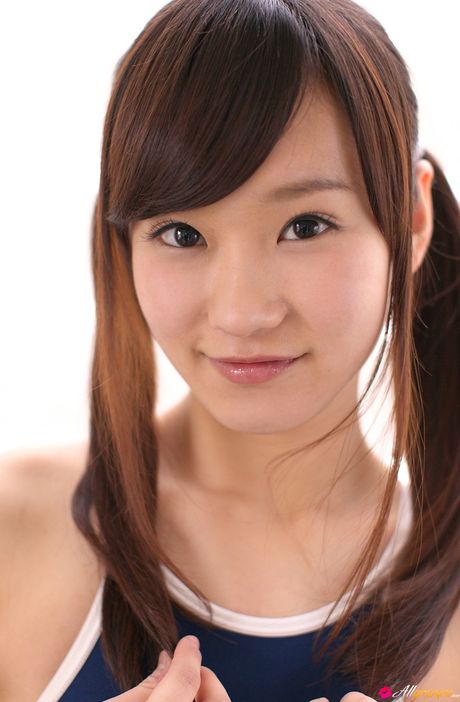 Asian doll Kana Yuuki removes her swimsuit before getting naked on a bed