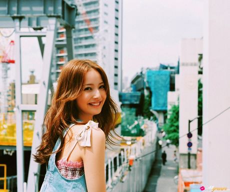 Devastating Asian teen Nozomi Sasaki displays her petite small tits and poses in a solo