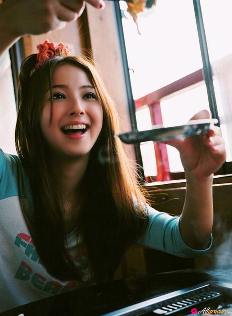 Devastating Asian teen Nozomi Sasaki displays her petite small tits and poses in a solo