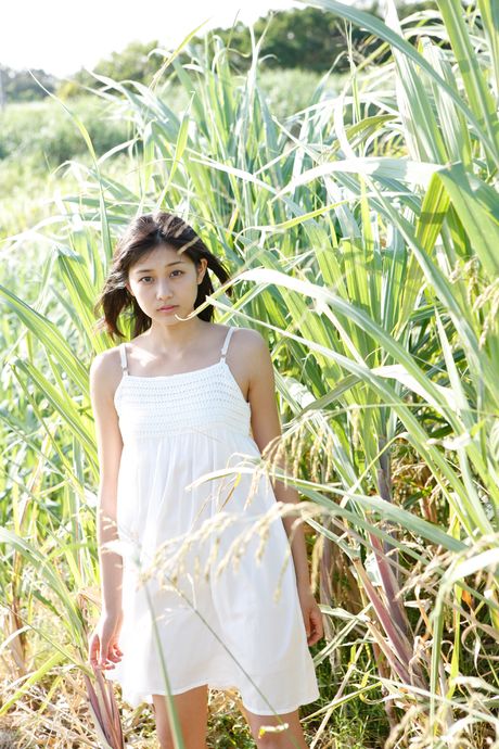 Asian girl Ayaka Wada gets naked on a patio chair in a sexy manner