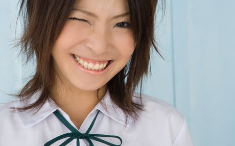 Asian babe Yui Kawakita demonstrates her petite tiny tits and poses in white stockings