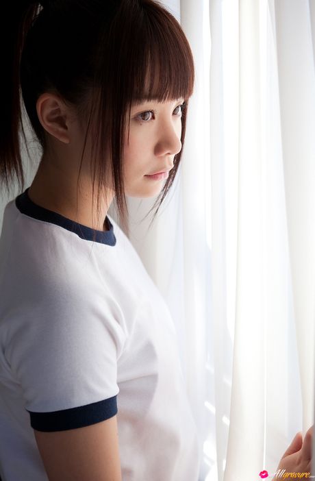 Asian cutie Mana exhibits her natural small tits and poses in her gym uniform