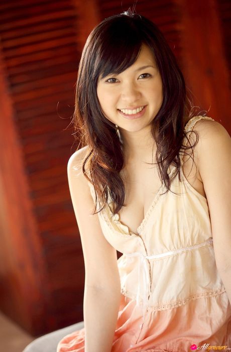 Asian teen Nana Ogura presents her nice tits and poses in her sexy lingerie