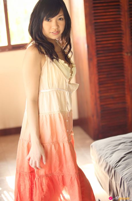 Asian teen Nana Ogura presents her nice tits and poses in her sexy lingerie