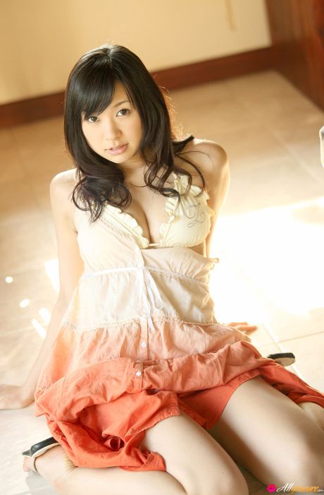 Asian teen Nana Ogura presents her nice tits and poses in her sexy lingerie