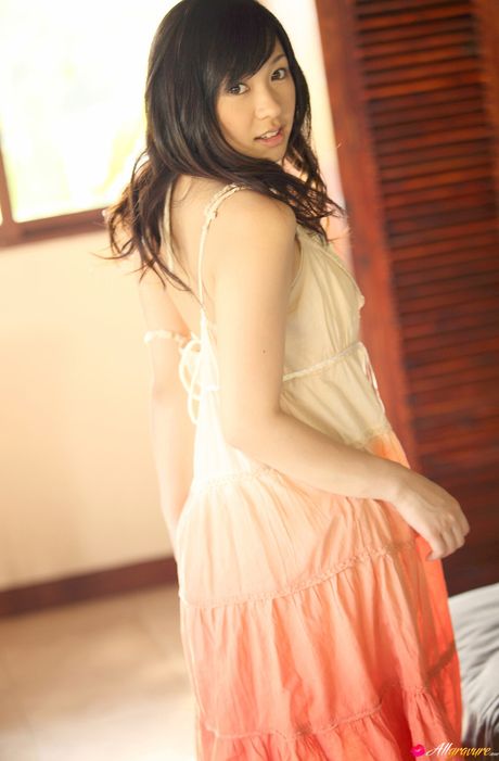 Asian teen Nana Ogura presents her nice tits and poses in her sexy lingerie