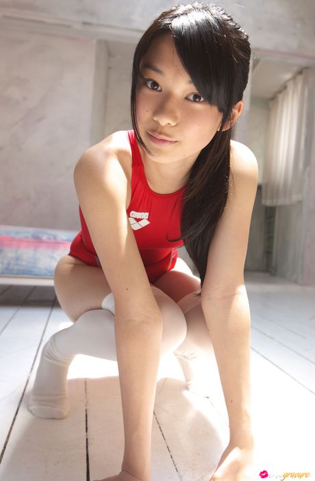 Asian cutie Tomoe Yamanaka removes her swimsuit and poses in white stockings