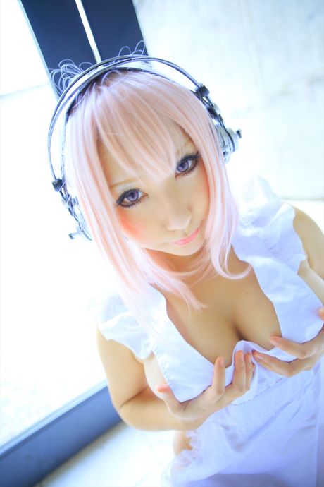 Big-Breasted japanese teen Saku strips her pink lingerie and shows her big juggs