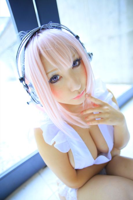 Big-Breasted japanese teen Saku strips her pink lingerie and shows her big juggs