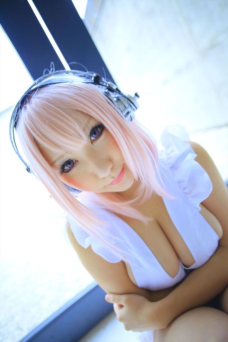 Big-Breasted japanese teen Saku strips her pink lingerie and shows her big juggs