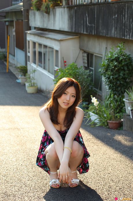 Asian girl Ai Haneda gets completely naked on a bed alluringly