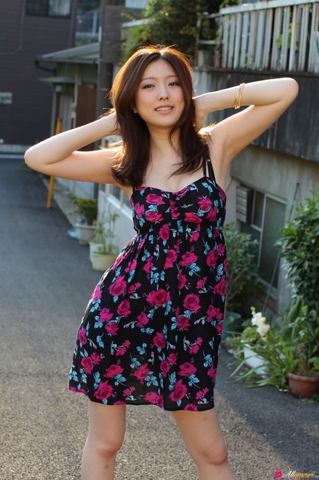 Asian girl Ai Haneda gets completely naked on a bed alluringly