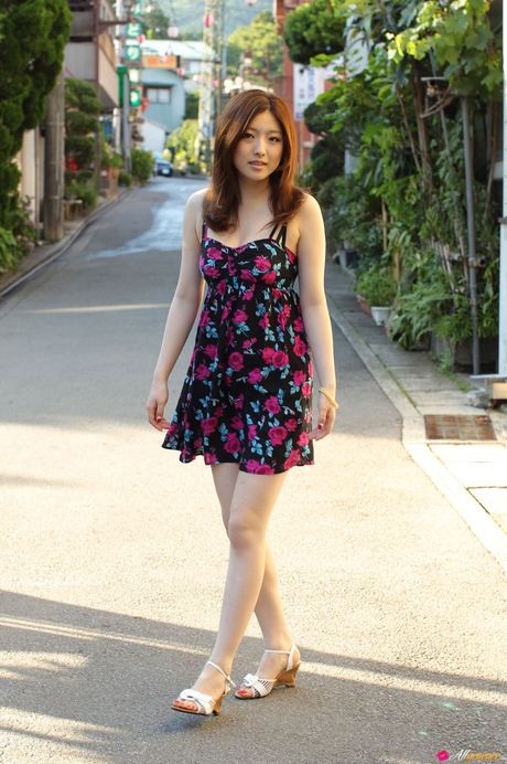 Asian girl Ai Haneda gets completely naked on a bed alluringly