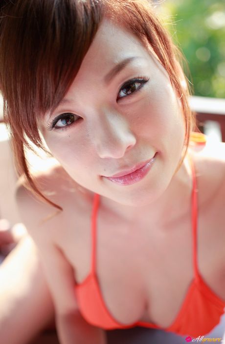 Asian babe Kaho Kasumi exhibits her amazing melons and poses in a red bikini