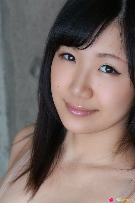 Asian teen Maki Hoshikawa goes naked on a sofa without embarrassment