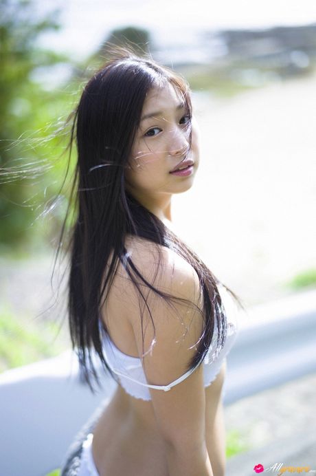 Asian doll Sayama Ayaka takes off her dress and goes naked for the camera in the yard