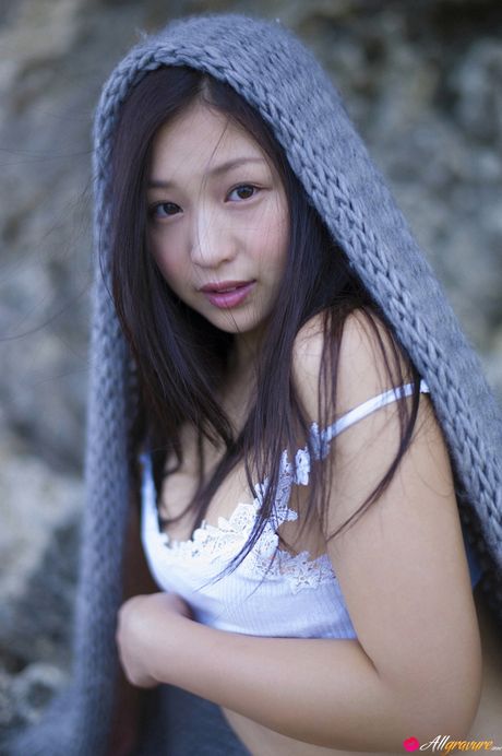 Asian doll Sayama Ayaka takes off her dress and goes naked for the camera in the yard