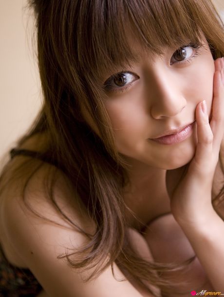 Asian model Yumi Sugimoto smokes a cigarette before getting naked