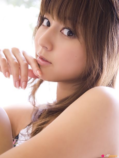 Asian model Yumi Sugimoto smokes a cigarette before getting naked