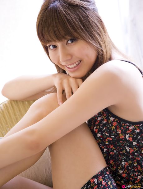 Asian model Yumi Sugimoto smokes a cigarette before getting naked