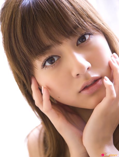 Asian model Yumi Sugimoto smokes a cigarette before getting naked