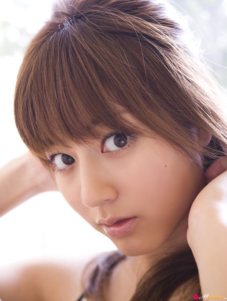 Asian model Yumi Sugimoto smokes a cigarette before getting naked