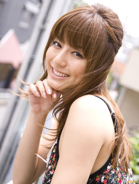 Asian model Yumi Sugimoto smokes a cigarette before getting naked