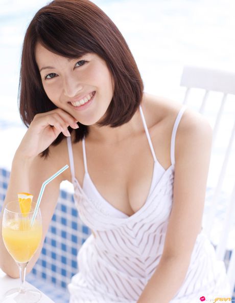 Asian girl Nao Utahara gets naked in a field of flowers