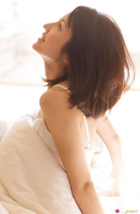 Asian girl Nao Utahara gets naked in a field of flowers