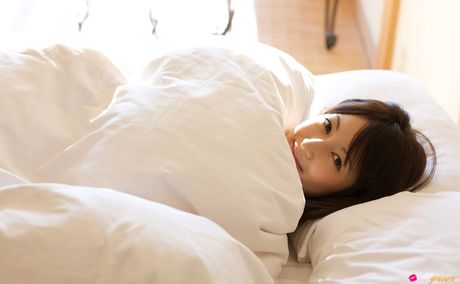 Asian girl Nao Utahara gets naked in a field of flowers