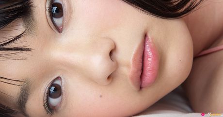 Asian babe Tomoe Yamanaka sports red lips while modelling in pink stockings