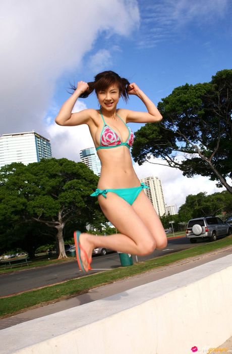 Striking Asian teen Aki Hoshino flaunts her big tits and poses in a bikini