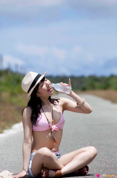 Asian babe Yume Kana gets naked in a hat and a pair of pink panties