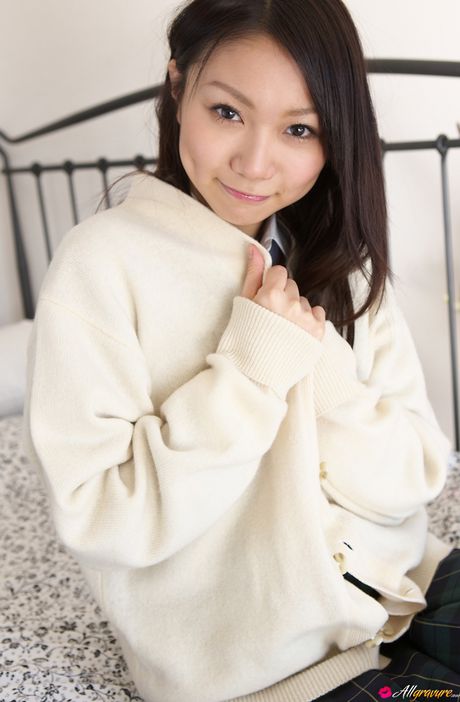 Asian schoolgirl Tomoyo Hoshino strips to stockings and poses outdoors