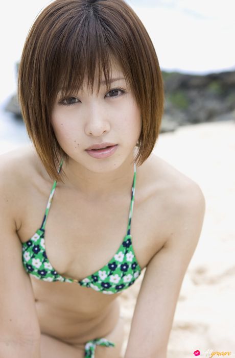 Brown-Eyed japanese beauty Marica Minami exhibits her small tits and hot ass in a bikini