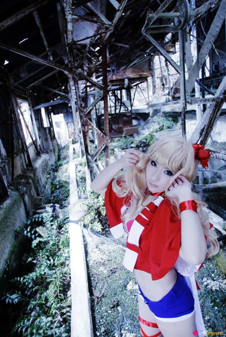 Blond japanese covergirl Saku reveals her nice tits and poses in a red dress