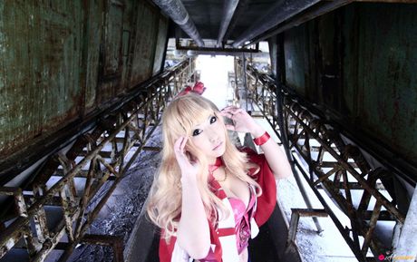 Blond japanese covergirl Saku reveals her nice tits and poses in a red dress