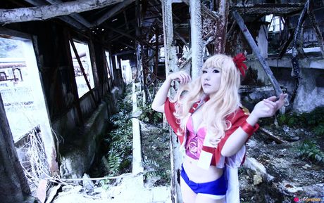 Blond japanese covergirl Saku reveals her nice tits and poses in a red dress