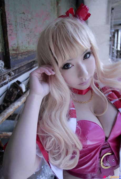 Blond japanese covergirl Saku reveals her nice tits and poses in a red dress