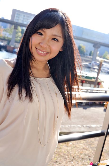 Asian girl Nana Ogura highlights her big butt and poses in a solo