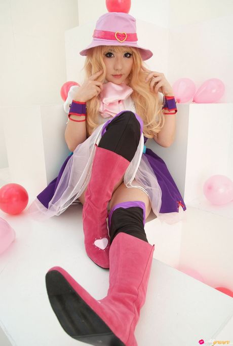 Blonde japanese girl Saku models a hat and boots in a sexy manner
