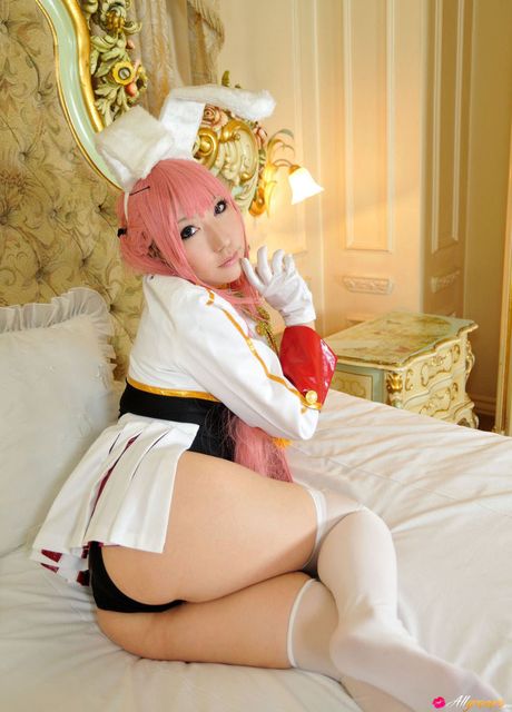 Asian doll Saku sports pink hair while modelling in white stockings