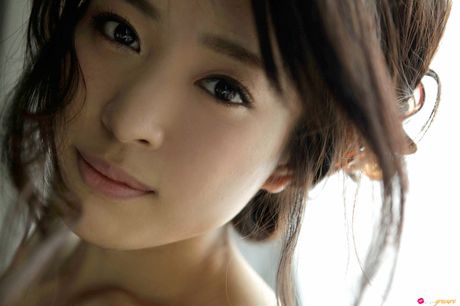 Asian doll Mei Kurokawa sports a creepy smile while getting naked